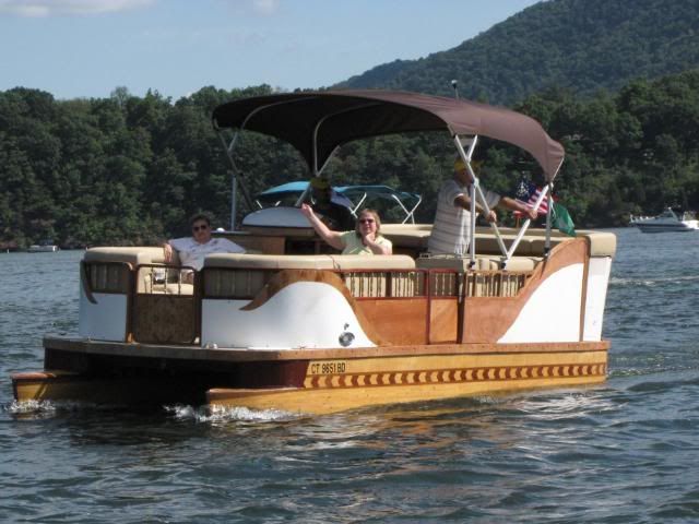 This is a finely crafted wooden pontoon boat. He took several years 